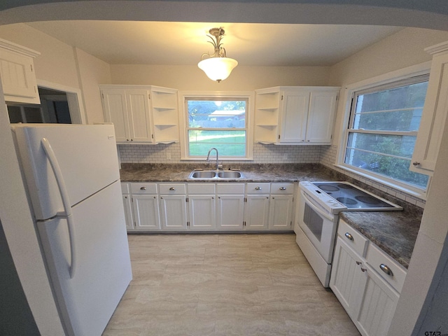 301 Harold St, Crockett, TX 75835 - kitchen featuring white appliances, open shelves, white cabinetry, and healthy amount of natural light