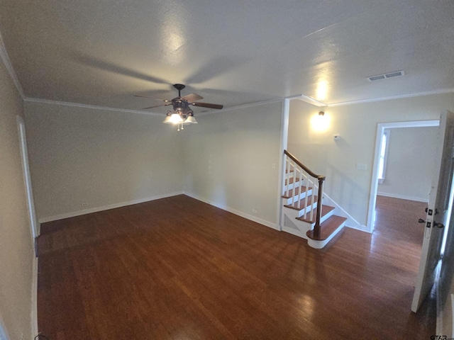 301 Harold St, Crockett, TX 75835 - unfurnished room featuring ornamental molding, wood finished floors, ceiling fan, and stairs