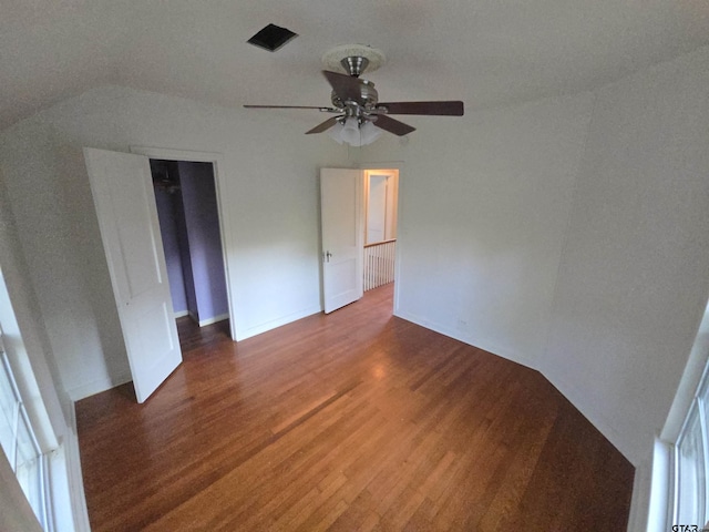 301 Harold St, Crockett, TX 75835 - unfurnished bedroom featuring wood finished floors, lofted ceiling, a ceiling fan, and a closet