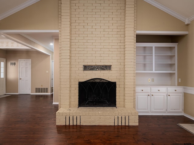 unfurnished living room with crown molding, lofted ceiling, a fireplace, and dark wood-type flooring