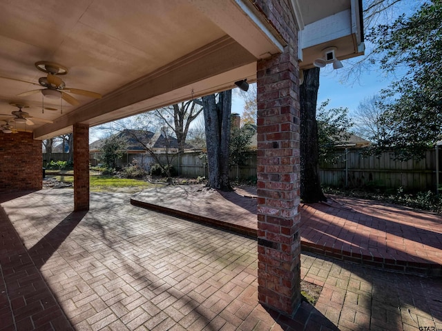 view of patio featuring ceiling fan