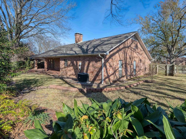 rear view of house with a yard