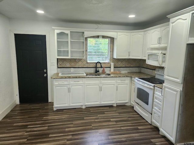 216 Mattison St, Pittsburg, TX 75686 - kitchen featuring white appliances, dark wood-type flooring, light stone counters, backsplash, and recessed lighting