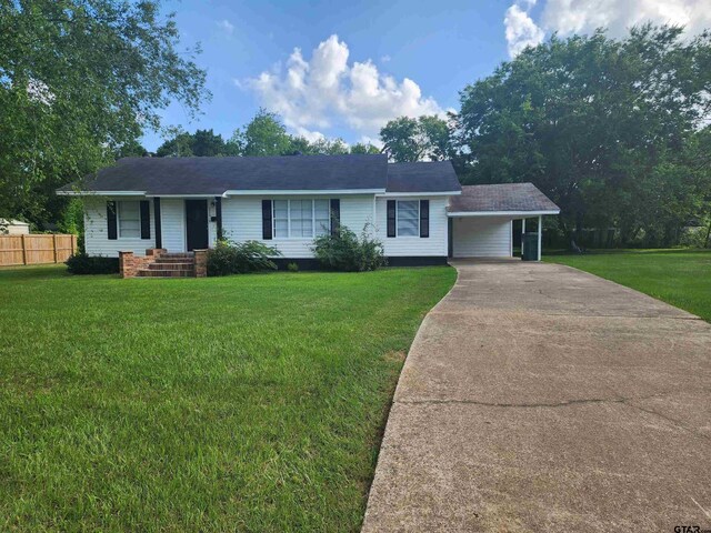 216 Mattison St, Pittsburg, TX 75686 - single story home featuring driveway and a carport