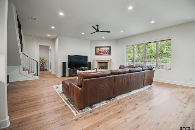 7863 Cross Rd, Tyler, TX 75703 - living room with a ceiling fan, light wood-style floors, recessed lighting, baseboards, and stairs