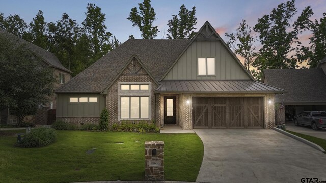 7863 Cross Rd, Tyler, TX 75703 - view of front facade featuring board and batten siding, concrete driveway, brick siding, and a front yard