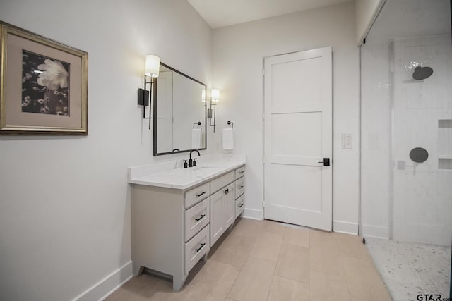 7863 Cross Rd, Tyler, TX 75703 - bathroom with vanity, baseboards, and a tile shower