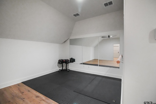 7863 Cross Rd, Tyler, TX 75703 - exercise room featuring vaulted ceiling, baseboards, and wood finished floors