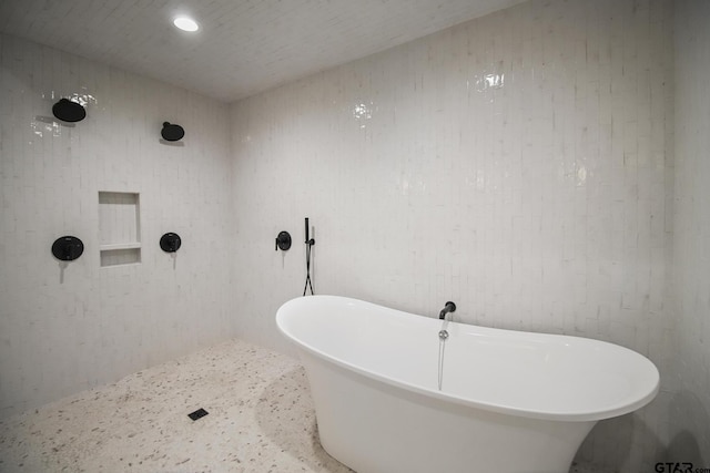 7863 Cross Rd, Tyler, TX 75703 - full bathroom featuring a freestanding tub, recessed lighting, and speckle patterned floor