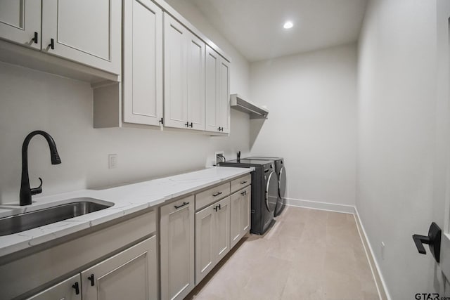 7863 Cross Rd, Tyler, TX 75703 - clothes washing area with cabinet space, washing machine and clothes dryer, baseboards, light tile patterned floors, and recessed lighting