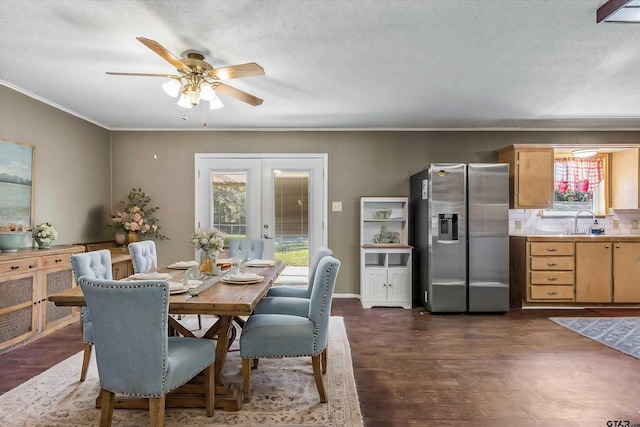 dining space featuring french doors, a textured ceiling, dark hardwood / wood-style flooring, sink, and ceiling fan