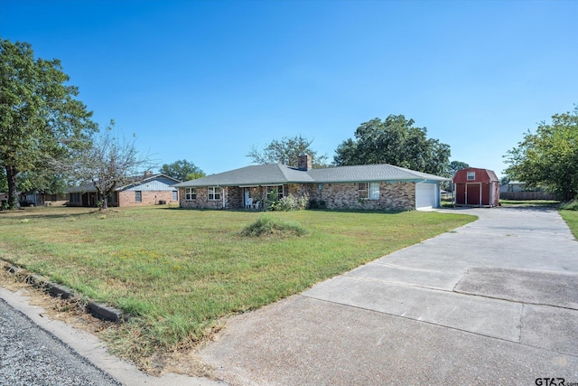 ranch-style house with a front lawn and a storage unit