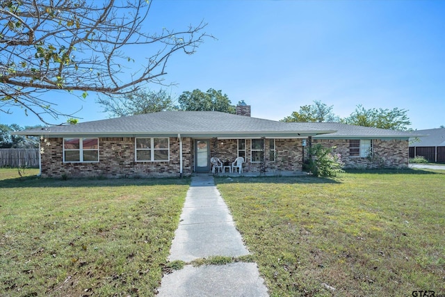 ranch-style home featuring a front yard