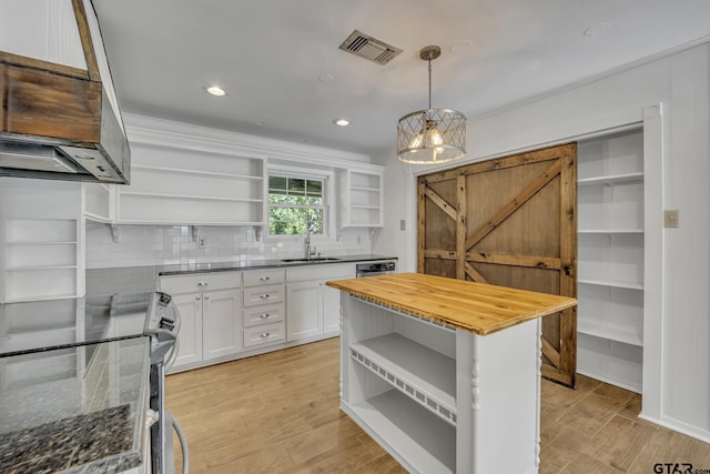 2010 County Road 4250, Winnsboro, TX 75494 - kitchen featuring open shelves, a sink, butcher block countertops, white cabinets, and recessed lighting