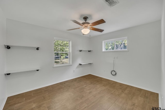 2010 County Road 4250, Winnsboro, TX 75494 - washroom with healthy amount of natural light, a ceiling fan, wood finished floors, and baseboards