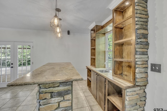 2010 County Road 4250, Winnsboro, TX 75494 - kitchen with open shelves, a sink, crown molding, french doors, and light tile patterned floors