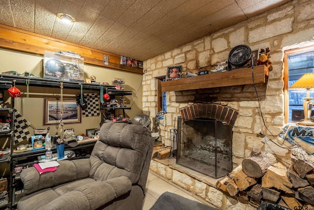 tiled living room featuring a fireplace