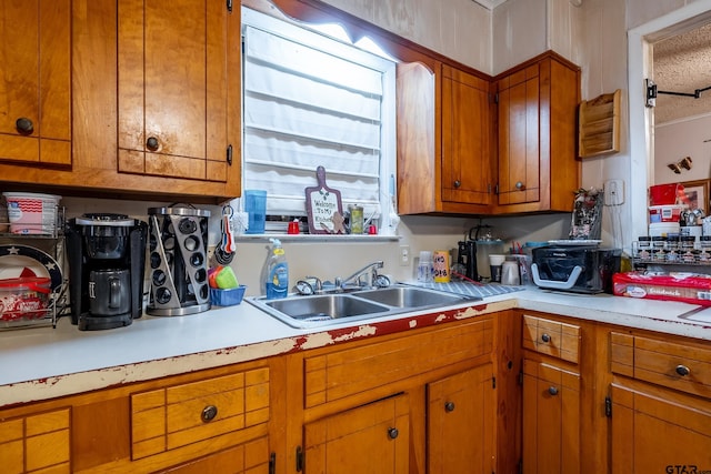 kitchen with sink and a textured ceiling