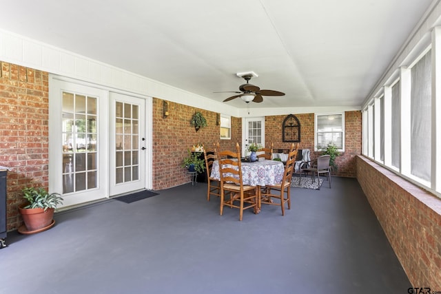 5513 Bostick Dr, Tyler, TX 75707 - sunroom / solarium featuring brick wall and finished concrete flooring