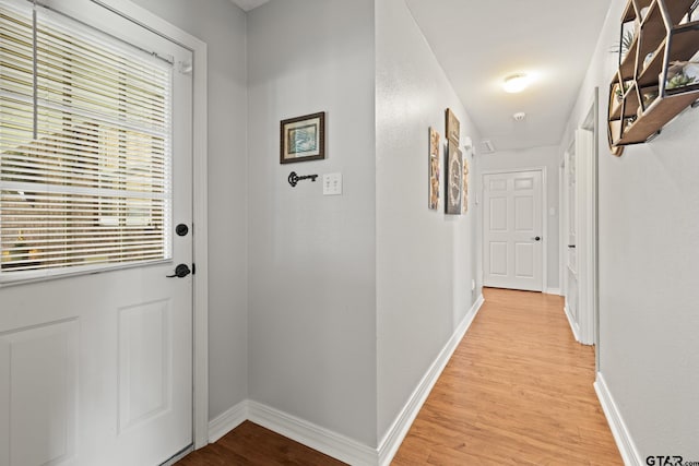 5513 Bostick Dr, Tyler, TX 75707 - entryway featuring light wood finished floors and baseboards