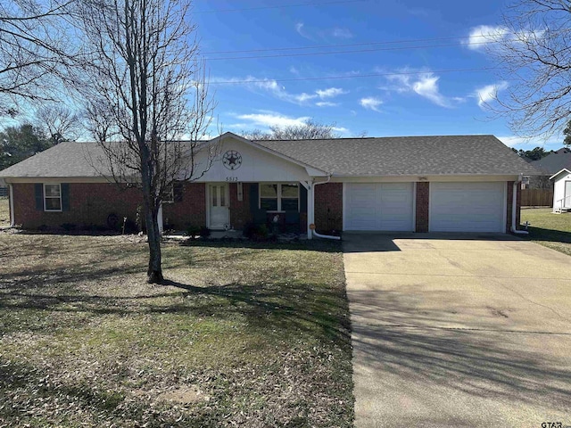 ranch-style home featuring brick siding, roof with shingles, an attached garage, driveway, and a front lawn