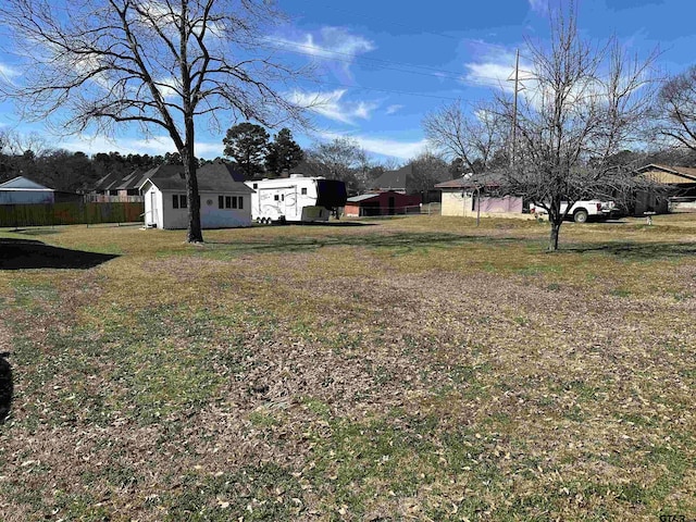 view of yard with a storage shed and an outdoor structure