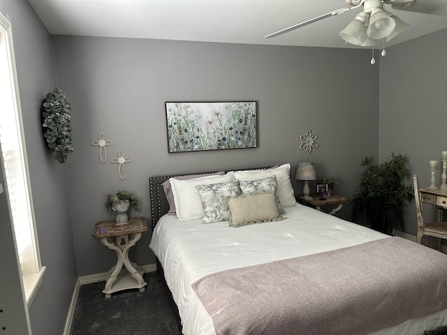 bedroom featuring carpet floors, ceiling fan, and baseboards