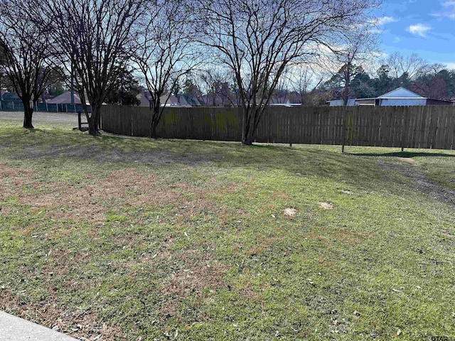 view of yard featuring fence