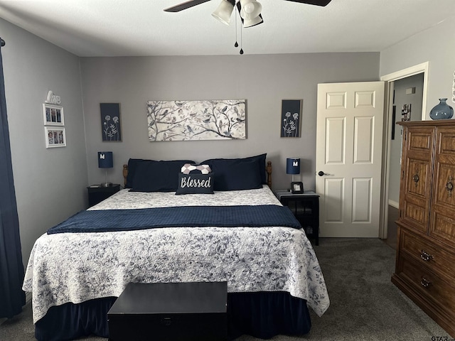 bedroom featuring dark colored carpet and a ceiling fan