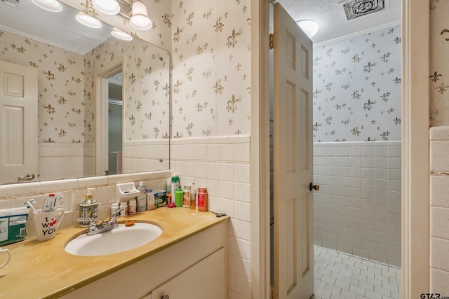 110 N Green St, Hawkins, TX 75765 - bathroom featuring wallpapered walls, vanity, and a wainscoted wall