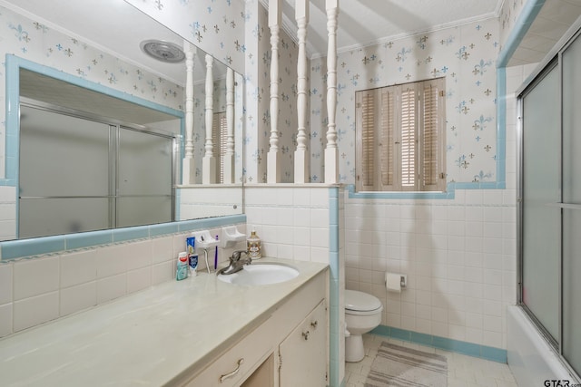 110 N Green St, Hawkins, TX 75765 - bathroom featuring toilet, wallpapered walls, tile walls, wainscoting, and tile patterned flooring