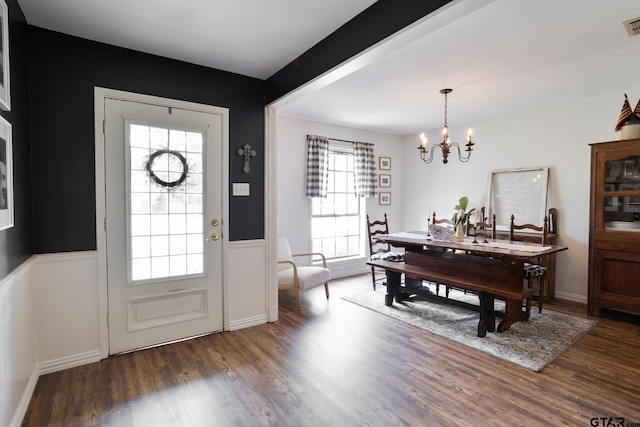 813 W Rieck Rd, Tyler, TX 75703 - entrance foyer featuring a wainscoted wall, a chandelier, wood finished floors, and a decorative wall