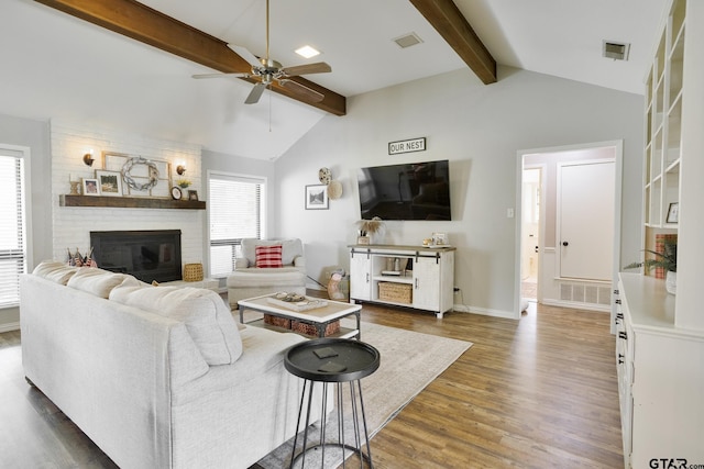 813 W Rieck Rd, Tyler, TX 75703 - living area featuring ceiling fan, wood finished floors, and a brick fireplace