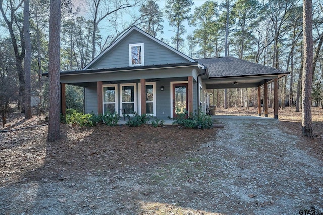 view of front facade featuring a porch and a carport