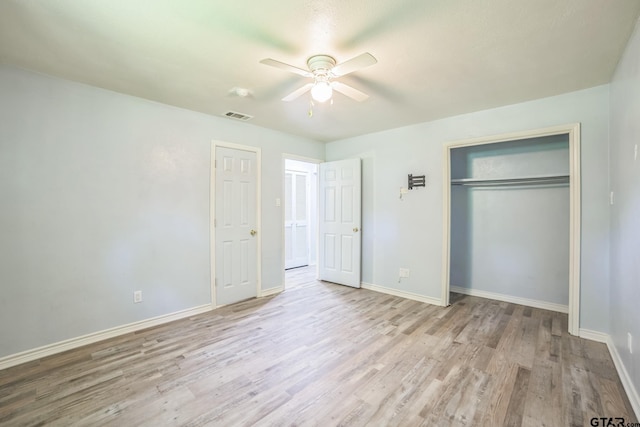 521 Hilltop Dr, Tool, TX 75143 - unfurnished bedroom featuring wood finished floors, a closet, baseboards, and a ceiling fan