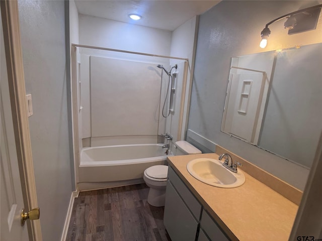 full bathroom featuring hardwood / wood-style flooring, vanity, toilet, and bathing tub / shower combination