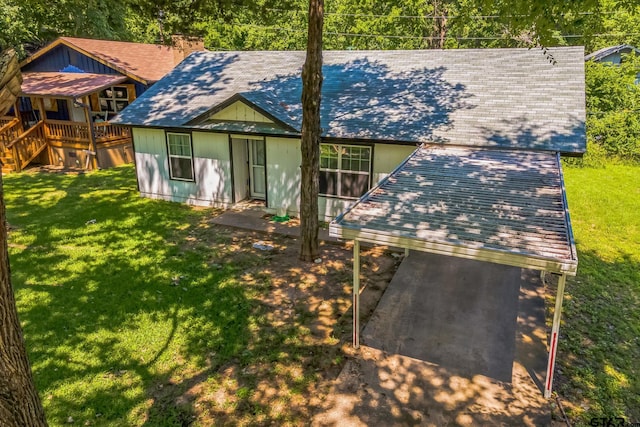 521 Hilltop Dr, Tool, TX 75143 - back of house featuring a lawn, a shingled roof, and a chimney