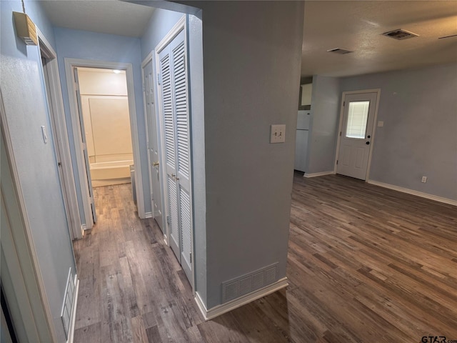 corridor featuring dark wood-type flooring