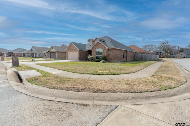 view of front facade featuring a front yard and a garage