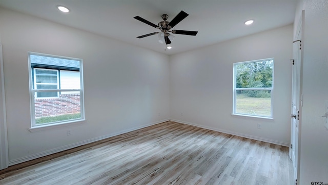 empty room with light hardwood / wood-style flooring and ceiling fan