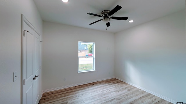 unfurnished bedroom featuring ceiling fan and light hardwood / wood-style floors