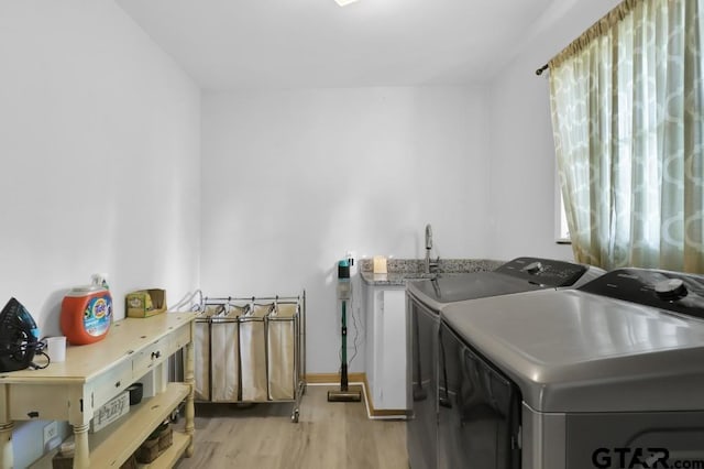150 Gambrell St, Rusk, TX 75785 - laundry room featuring washer and clothes dryer and light wood-type flooring