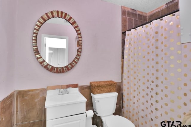 150 Gambrell St, Rusk, TX 75785 - full bath with vanity, a shower with shower curtain, and tile walls