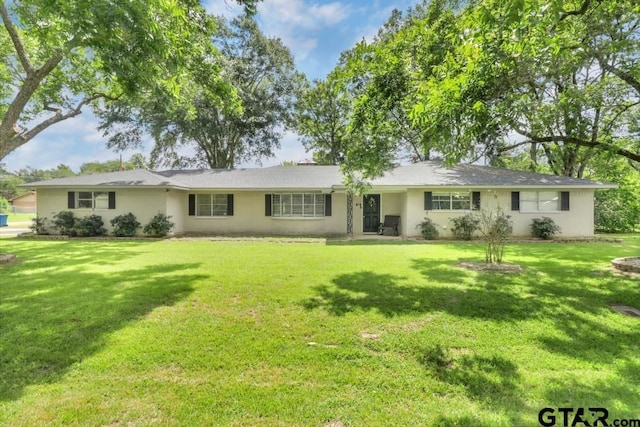 150 Gambrell St, Rusk, TX 75785 - ranch-style home featuring stucco siding and a front lawn