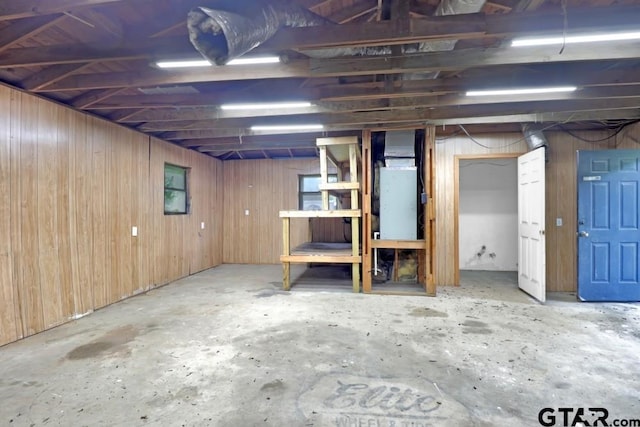 150 Gambrell St, Rusk, TX 75785 - unfinished below grade area with wood walls and heating unit