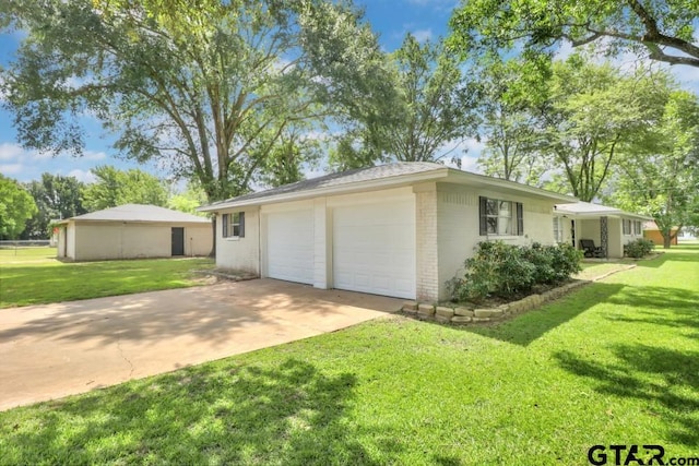 150 Gambrell St, Rusk, TX 75785 - view of side of property featuring brick siding, a yard, an attached garage, and concrete driveway