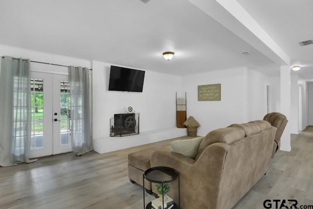 150 Gambrell St, Rusk, TX 75785 - living room with light wood-style flooring and french doors
