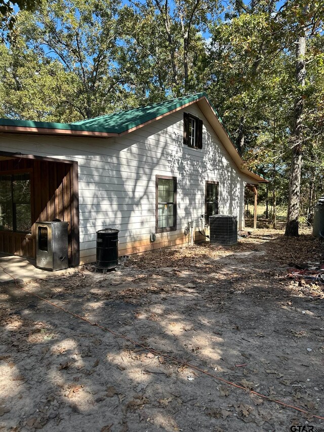 11420 C R 420, Tyler, TX 75704 - view of side of property featuring cooling unit and metal roof