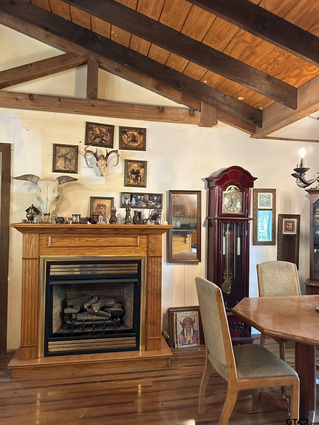 dining space featuring hardwood / wood-style floors, wood ceiling, and vaulted ceiling with beams