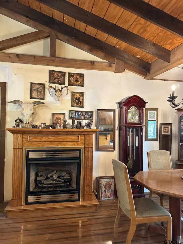 11420 C R 420, Tyler, TX 75704 - dining area with wood finished floors, a fireplace with raised hearth, and wooden ceiling with exposed beams